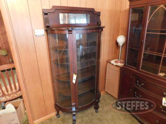 Curved glass curio cabinet with mirror